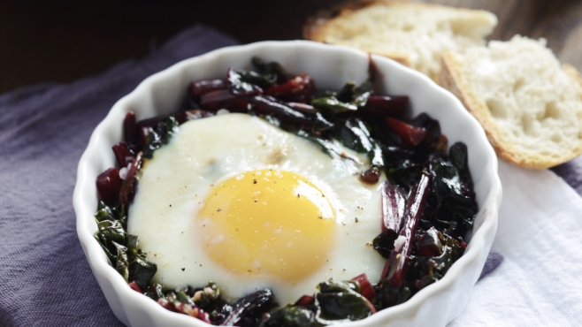eggs baked on beet greens