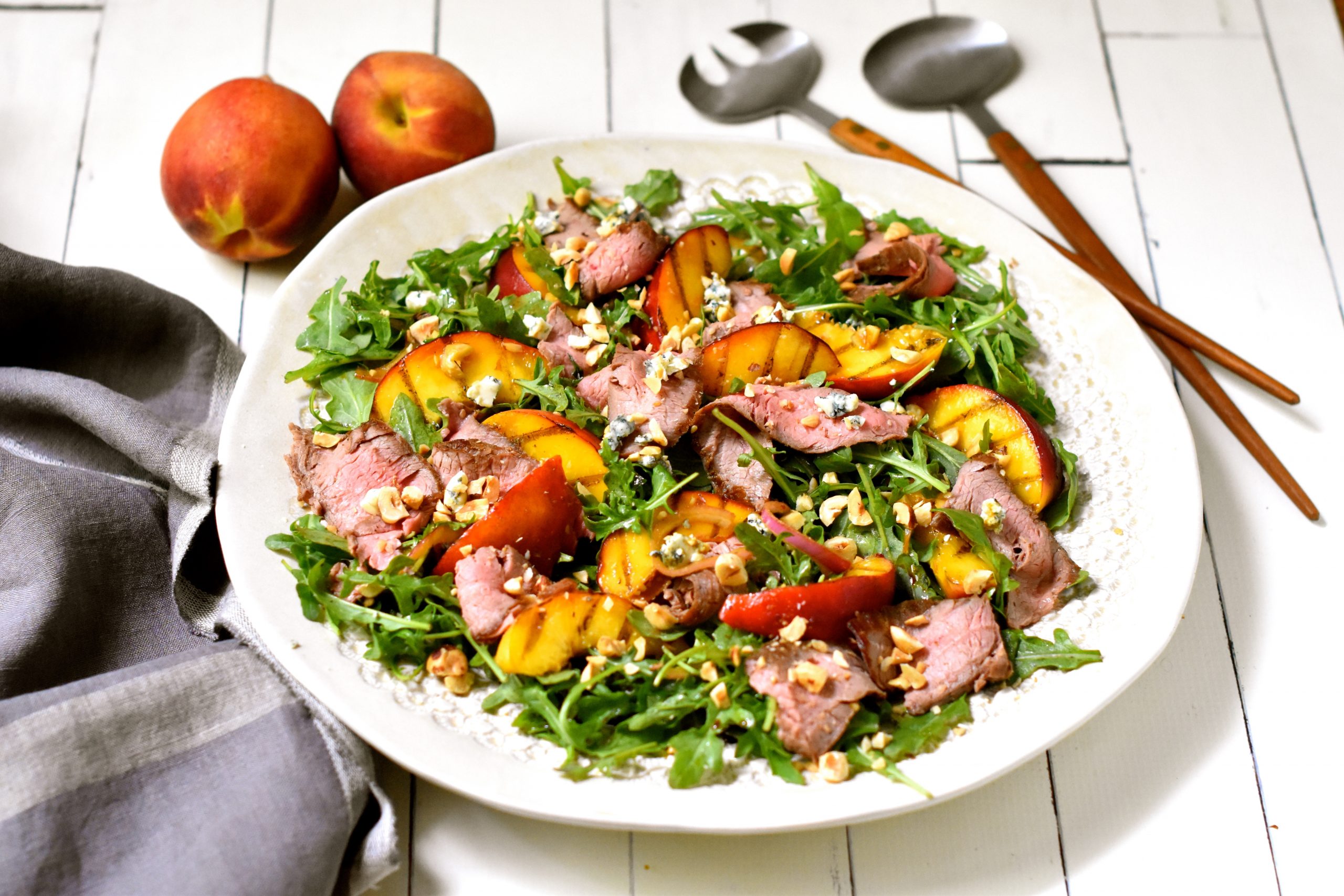Grilled Flank Steak, Peaches, Blue Cheese on Arugula - Edible Nashville